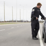 The real reason police tap your car in traffic stops