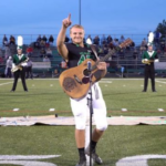 No one was willing to sing the national anthem, so one high schooler took off his helmet and grabbed a guitar